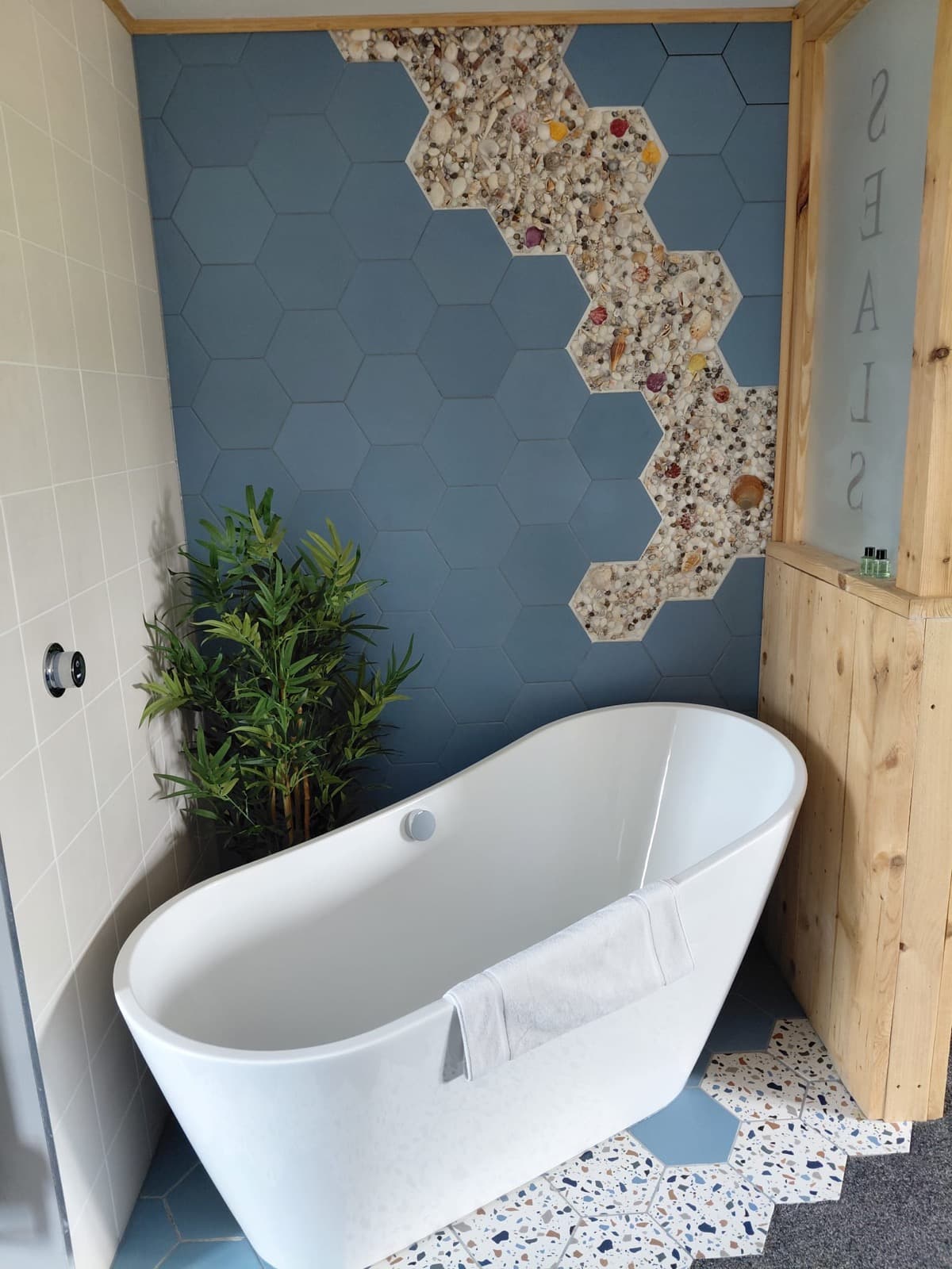 A bathroom with a freestanding bath at Seals Bacton