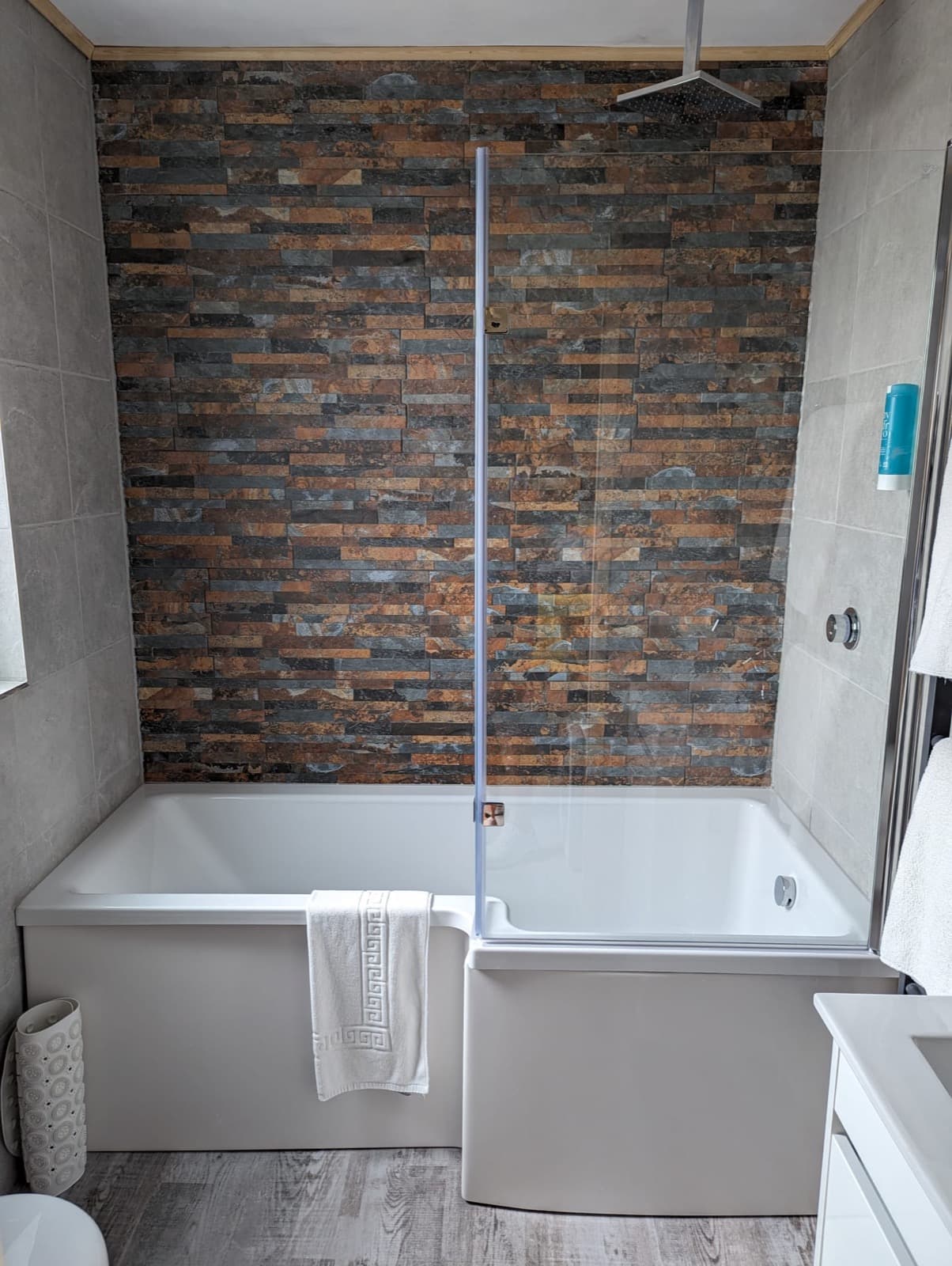 A guest bathroom with a shower bath at Seals Bacton