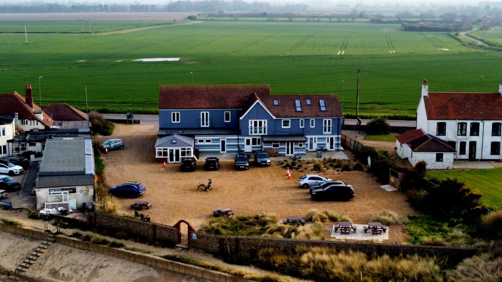 An aerial view of Seals Bacton close to fields and the sea