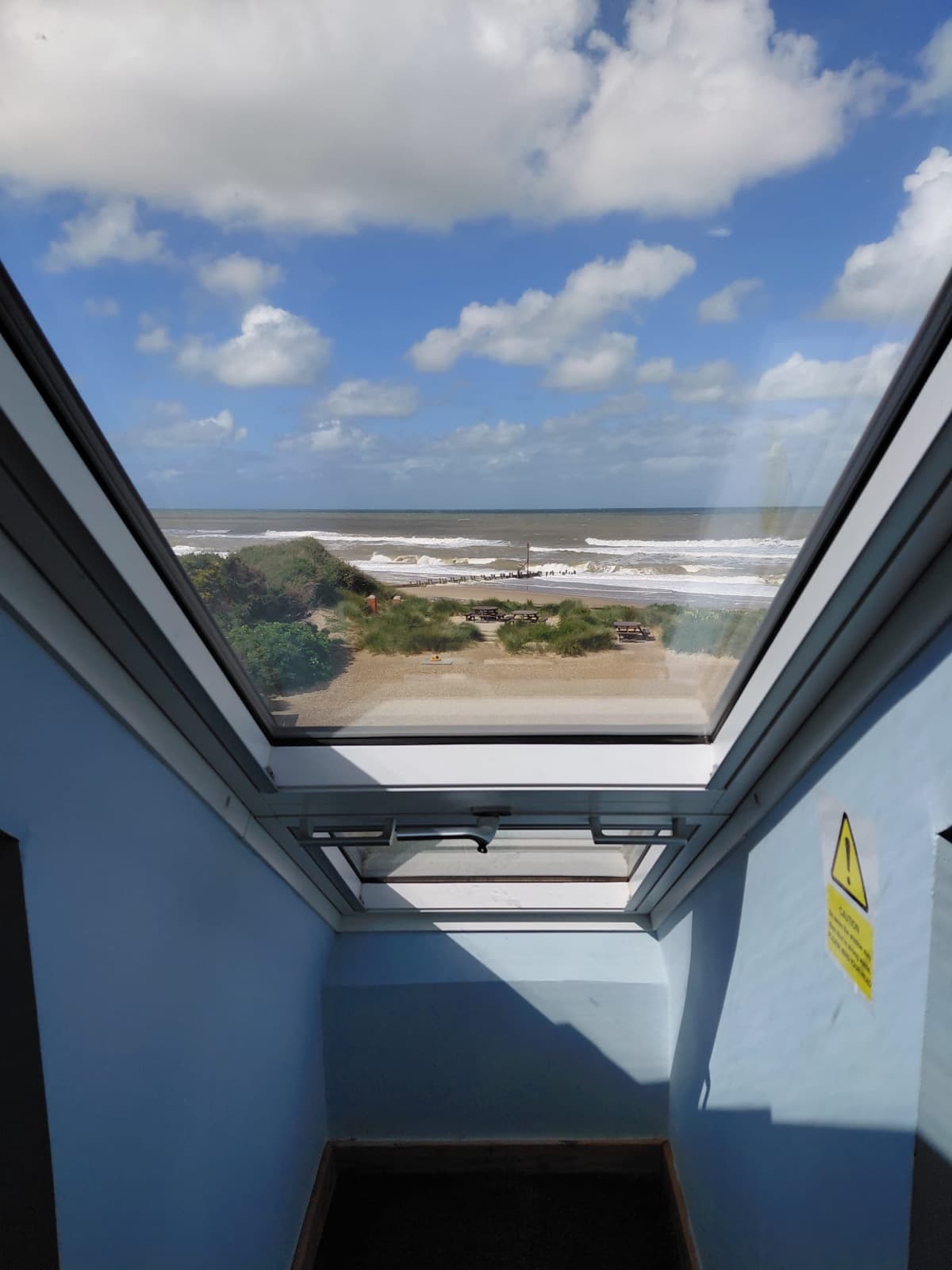 A view of the sea through a window at Seals Bacton