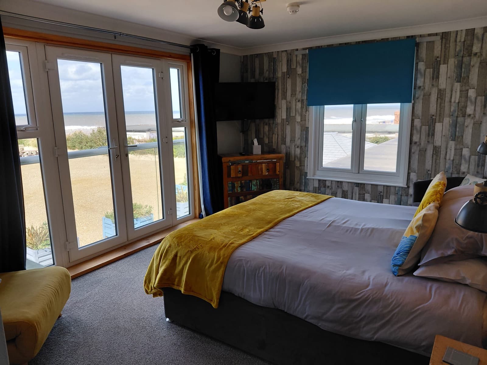 A ground-floor room at Seals Bacton with patio doors
